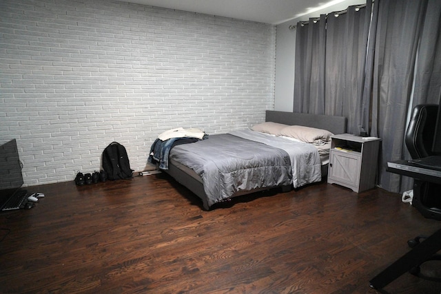 3321 W 71st St, Chicago, IL 60629 - bedroom with brick wall and dark wood-style flooring