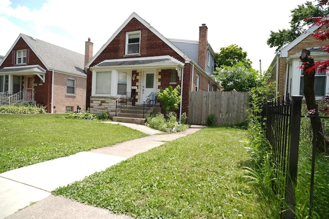3321 W 71st St, Chicago, IL 60629 - bungalow-style house with a chimney and brick siding