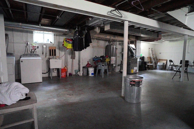 3321 W 71st St, Chicago, IL 60629 - below grade area featuring washing machine and clothes dryer, gas water heater, and heating unit
