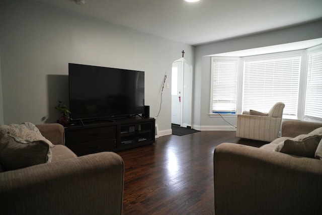 3321 W 71st St, Chicago, IL 60629 - living area with dark wood-style flooring and baseboards