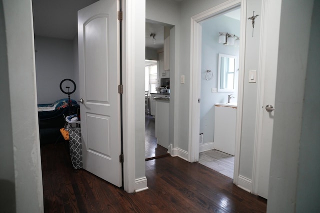3321 W 71st St, Chicago, IL 60629 - hallway featuring dark wood finished floors and baseboards