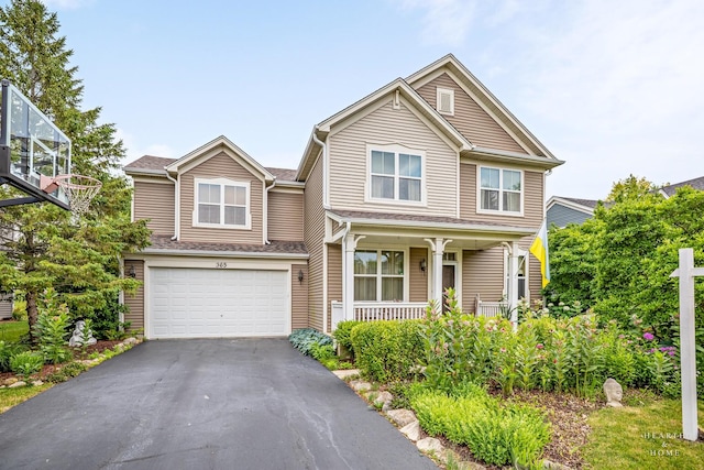 365 Oakmont Dr, Cary, IL 60013 - view of front facade featuring covered porch, driveway, and a garage