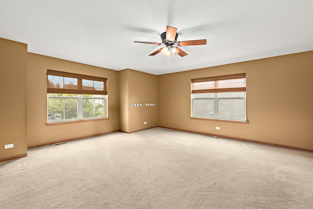 365 Oakmont Dr, Cary, IL 60013 - carpeted spare room with a ceiling fan and baseboards