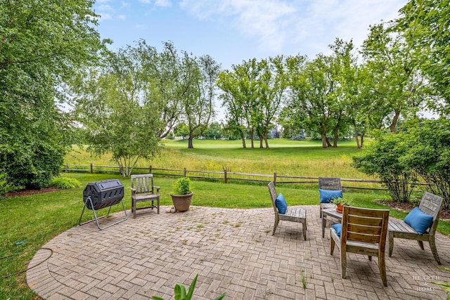 365 Oakmont Dr, Cary, IL 60013 - fenced backyard featuring a patio and a grill