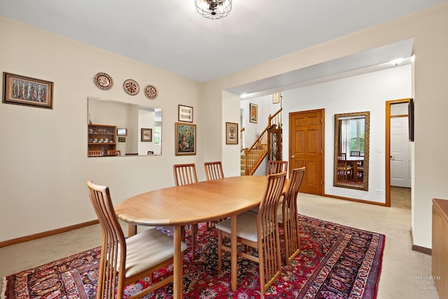 365 Oakmont Dr, Cary, IL 60013 - dining area featuring light colored carpet and stairway