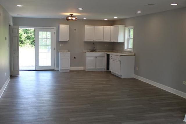 43 E 145th St, Harvey, IL 60426 - kitchen with healthy amount of natural light, white cabinets, dark wood-style flooring, recessed lighting, and light countertops