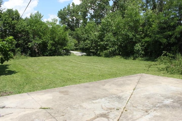 43 E 145th St, Harvey, IL 60426 - view of grassy yard featuring a patio