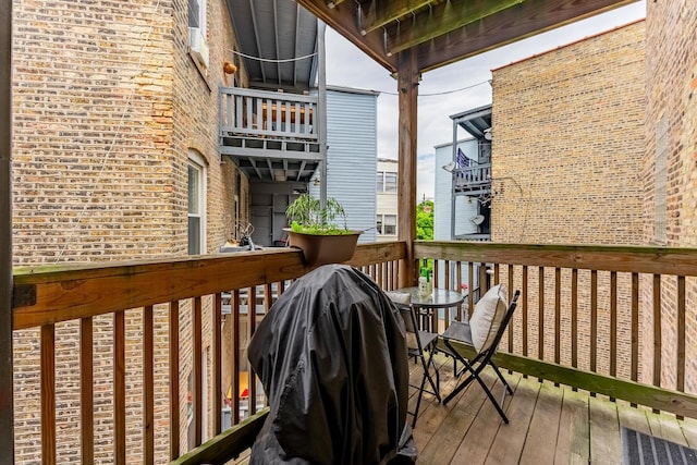 2716 N Kedzie Ave Unit 2, Chicago, IL 60647 - wooden terrace with outdoor dining area