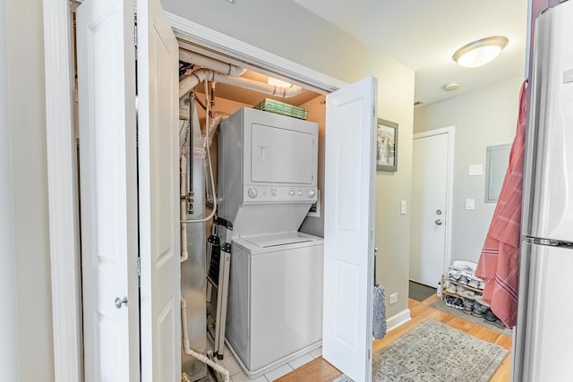 2716 N Kedzie Ave Unit 2, Chicago, IL 60647 - laundry room with stacked washer / drying machine and light wood-style floors