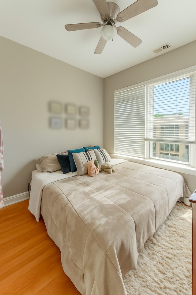 2716 N Kedzie Ave Unit 2, Chicago, IL 60647 - bedroom featuring light wood-style flooring and ceiling fan