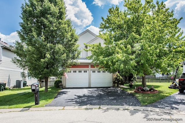 2325 N Lenox Ct, Round Lake Beach, IL 60073 - obstructed view of property featuring driveway and an attached garage