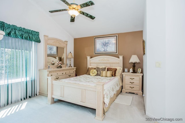 2325 N Lenox Ct, Round Lake Beach, IL 60073 - bedroom featuring light colored carpet, vaulted ceiling, and a ceiling fan