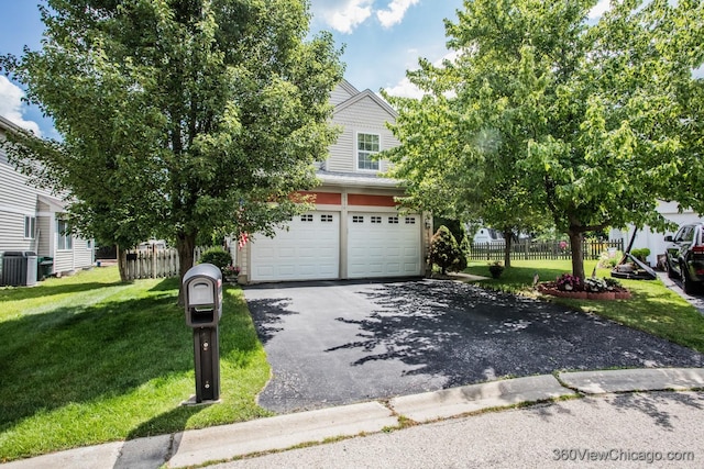 2325 N Lenox Ct, Round Lake Beach, IL 60073 - view of property hidden behind natural elements featuring asphalt driveway and a garage