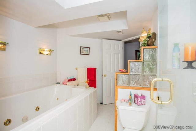 2325 N Lenox Ct, Round Lake Beach, IL 60073 - bathroom featuring a whirlpool tub and tile patterned floors