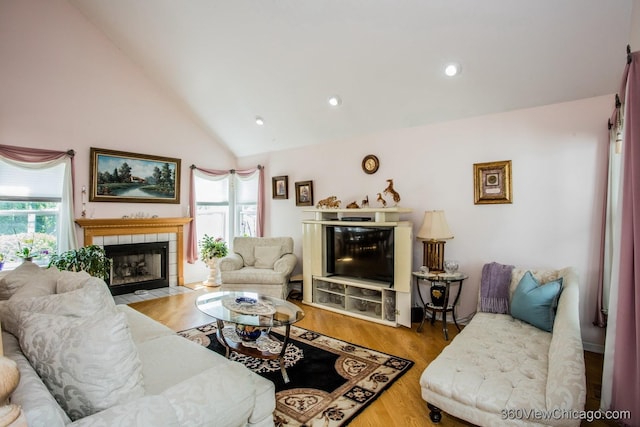 2325 N Lenox Ct, Round Lake Beach, IL 60073 - living area with a fireplace, wood finished floors, and high vaulted ceiling