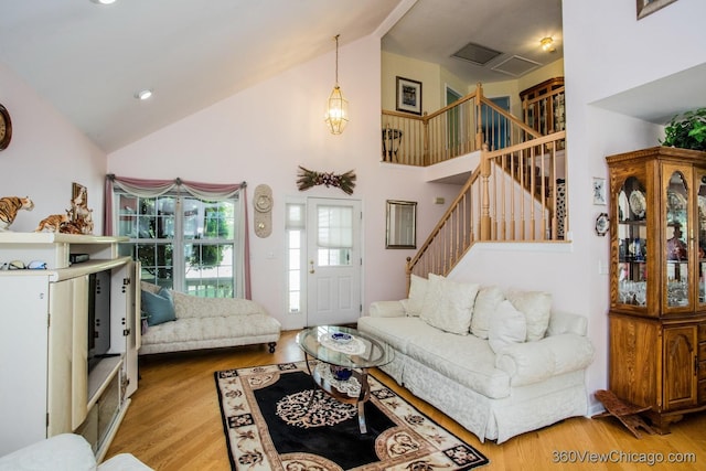 2325 N Lenox Ct, Round Lake Beach, IL 60073 - living room featuring stairway, wood finished floors, and high vaulted ceiling