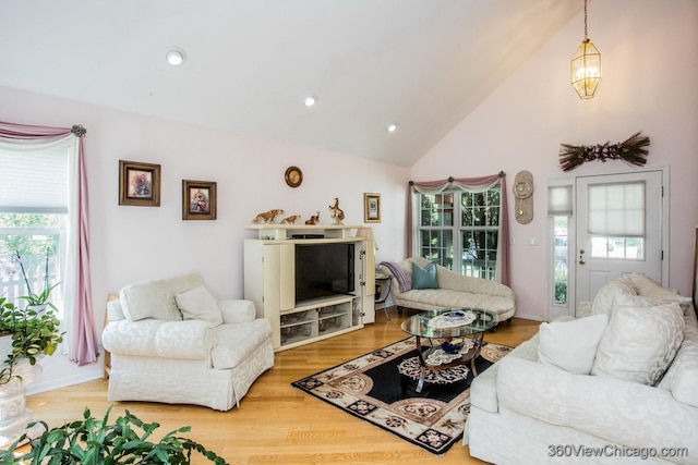 2325 N Lenox Ct, Round Lake Beach, IL 60073 - living room featuring wood finished floors, high vaulted ceiling, and recessed lighting