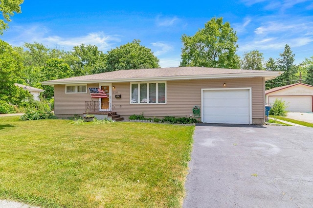 556 W River St, Bourbonnais, IL 60914 - ranch-style house featuring a front lawn, an attached garage, and driveway
