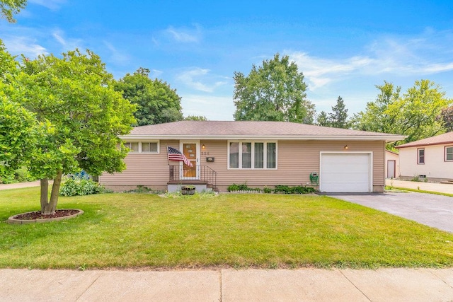 556 W River St, Bourbonnais, IL 60914 - ranch-style home with an attached garage, driveway, and a front lawn