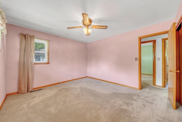 556 W River St, Bourbonnais, IL 60914 - empty room featuring carpet floors and a ceiling fan