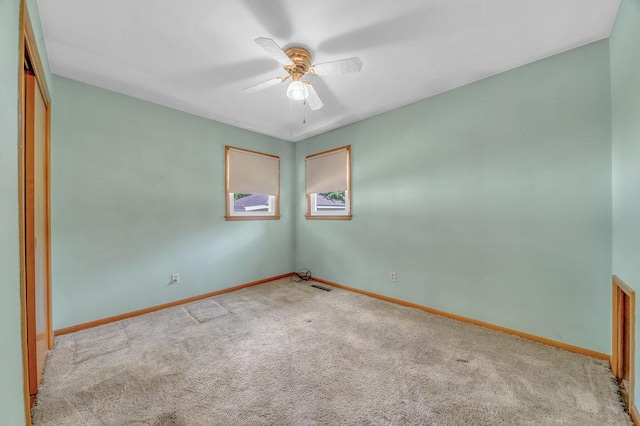 556 W River St, Bourbonnais, IL 60914 - unfurnished room with carpet floors and a ceiling fan