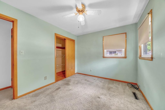 556 W River St, Bourbonnais, IL 60914 - unfurnished bedroom featuring carpet flooring, a closet, and ceiling fan