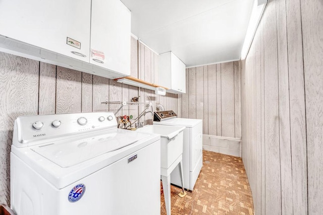 556 W River St, Bourbonnais, IL 60914 - laundry area featuring washing machine and dryer and wood walls