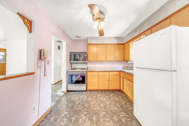556 W River St, Bourbonnais, IL 60914 - kitchen with white appliances, ceiling fan, light countertops, and light flooring