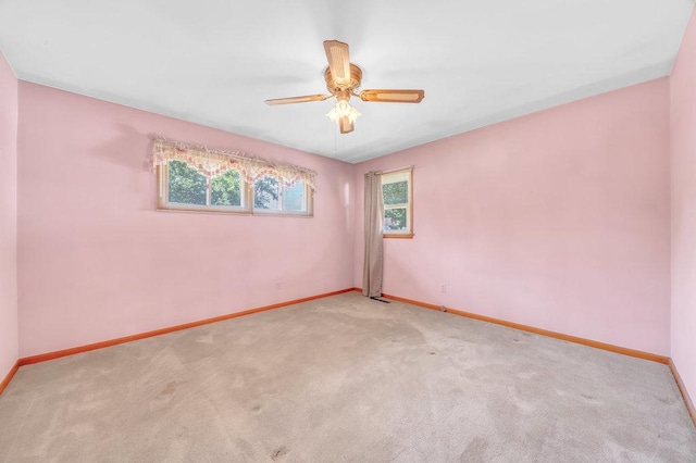 556 W River St, Bourbonnais, IL 60914 - carpeted spare room with baseboards and ceiling fan