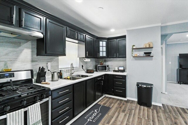 1518 Lucia Ave, Waukegan, IL 60085 - kitchen with stainless steel appliances, ornamental molding, dark cabinets, light countertops, and decorative backsplash