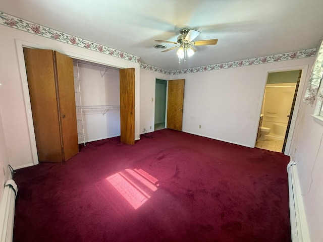 1340 Jeffrey Dr, Rantoul, IL 61866 - unfurnished bedroom with baseboard heating, carpet flooring, a closet, and a ceiling fan