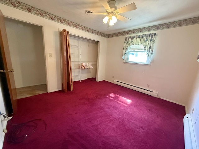 1340 Jeffrey Dr, Rantoul, IL 61866 - unfurnished bedroom with a baseboard radiator, a baseboard heating unit, dark colored carpet, a closet, and a ceiling fan