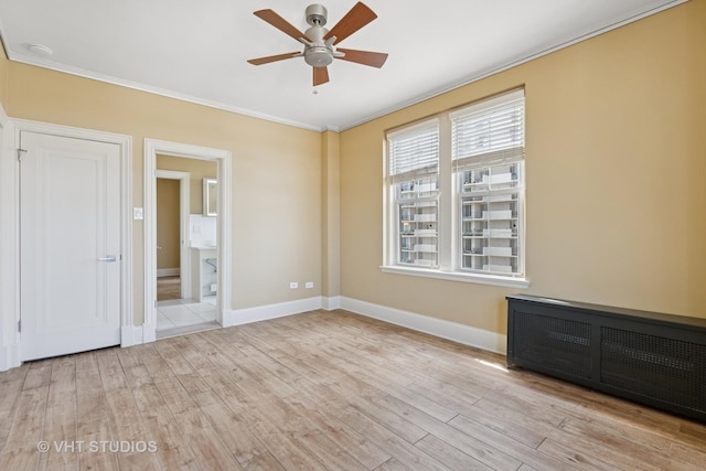 6101 N Sheridan Rd Unit 11C, Chicago, IL 60660 - empty room with ceiling fan, crown molding, wood finished floors, and radiator heating unit