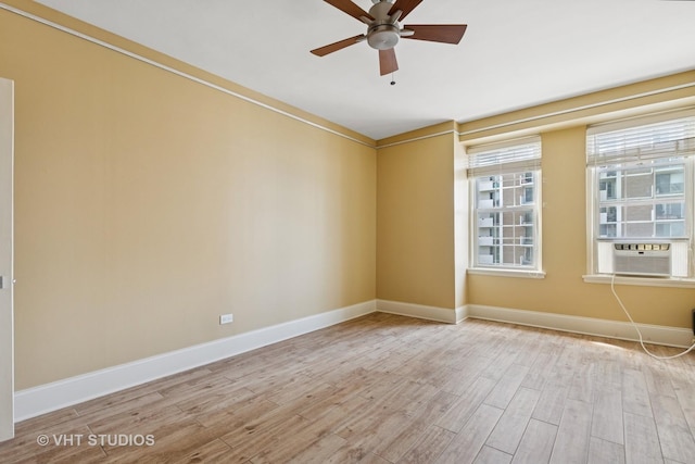 6101 N Sheridan Rd Unit 11C, Chicago, IL 60660 - empty room featuring cooling unit, wood finished floors, and ceiling fan