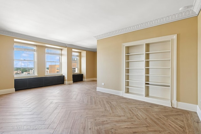 6101 N Sheridan Rd Unit 11C, Chicago, IL 60660 - spare room with plenty of natural light, built in shelves, a smoke detector, and crown molding