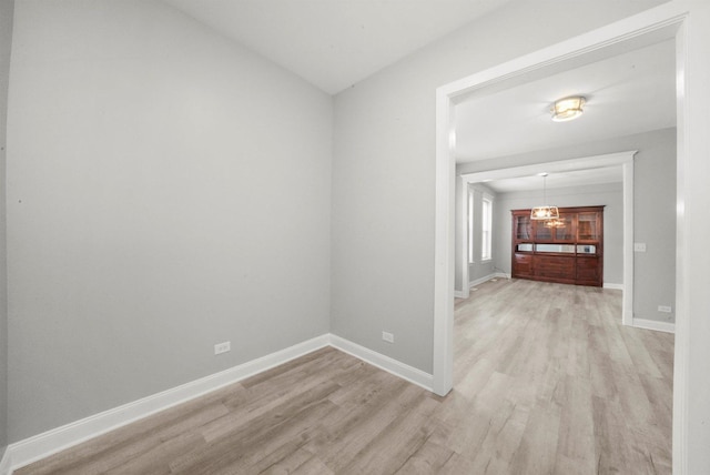 5401 W 22nd Pl, Cicero, IL 60804 - unfurnished room featuring light wood finished floors, a chandelier, and lofted ceiling