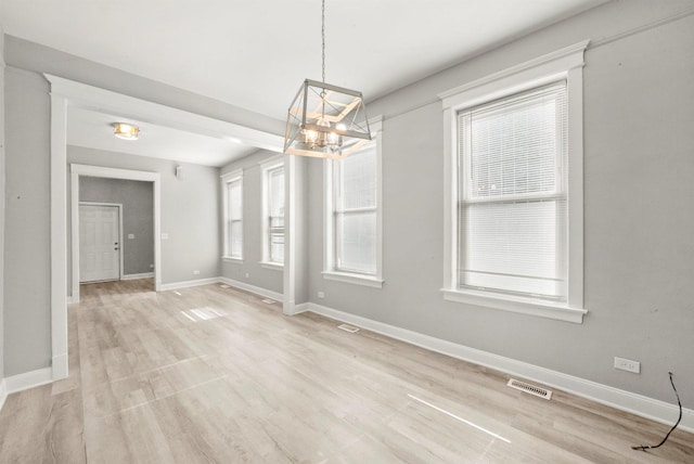 5401 W 22nd Pl, Cicero, IL 60804 - unfurnished dining area with a chandelier and light wood-type flooring