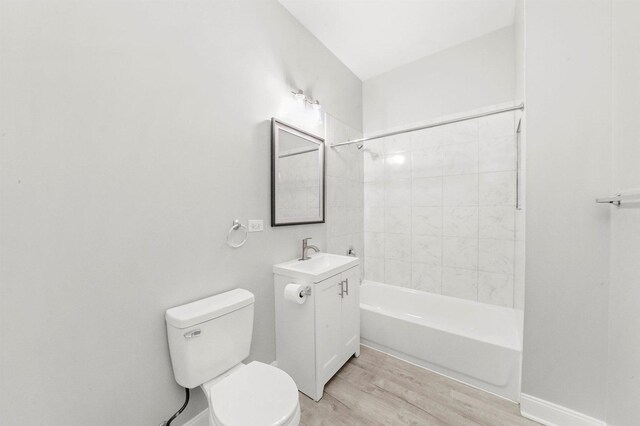 5401 W 22nd Pl, Cicero, IL 60804 - bathroom with wood finished floors, vanity, and bathing tub / shower combination