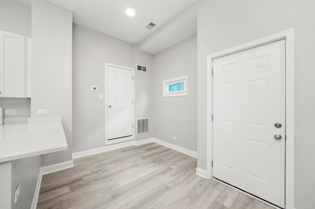 5401 W 22nd Pl, Cicero, IL 60804 - laundry room featuring light wood finished floors and baseboards