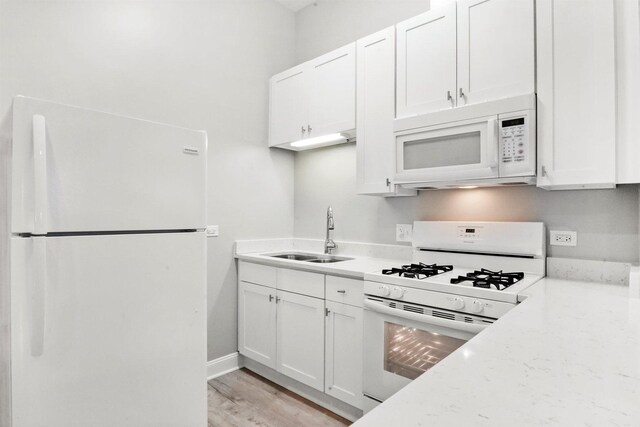 5401 W 22nd Pl, Cicero, IL 60804 - kitchen with white appliances, white cabinets, and light wood finished floors