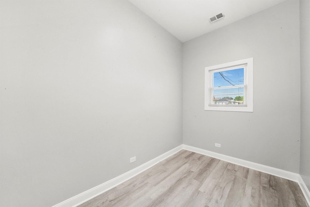 5401 W 22nd Pl, Cicero, IL 60804 - empty room featuring light wood-style floors and vaulted ceiling