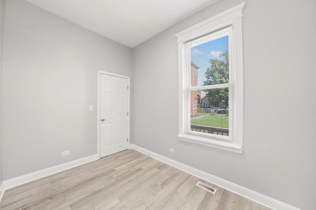 5401 W 22nd Pl, Cicero, IL 60804 - empty room with healthy amount of natural light and light wood-style floors