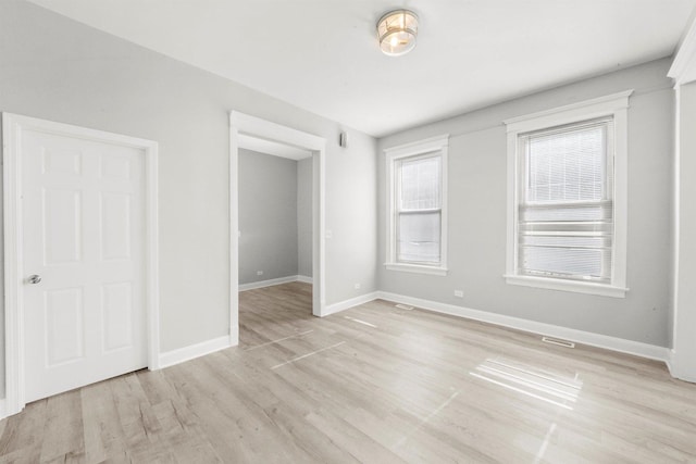 5401 W 22nd Pl, Cicero, IL 60804 - unfurnished bedroom featuring light wood finished floors and baseboards