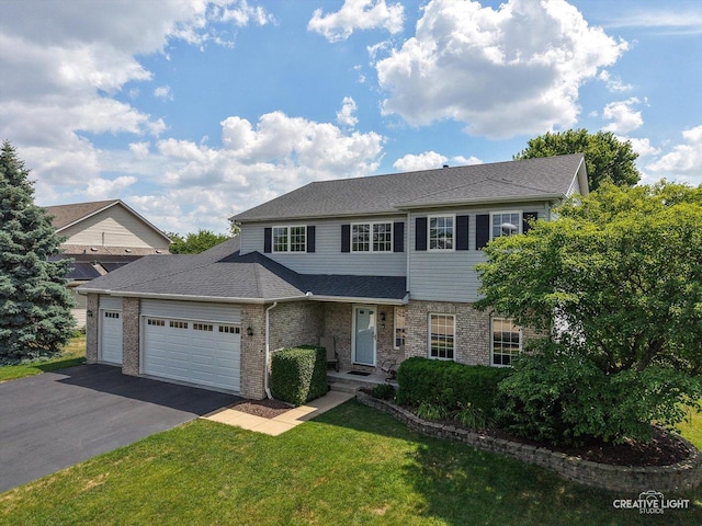 210 Fox Chase Dr N, Oswego, IL 60543 - traditional-style home with a garage, asphalt driveway, brick siding, and a front lawn