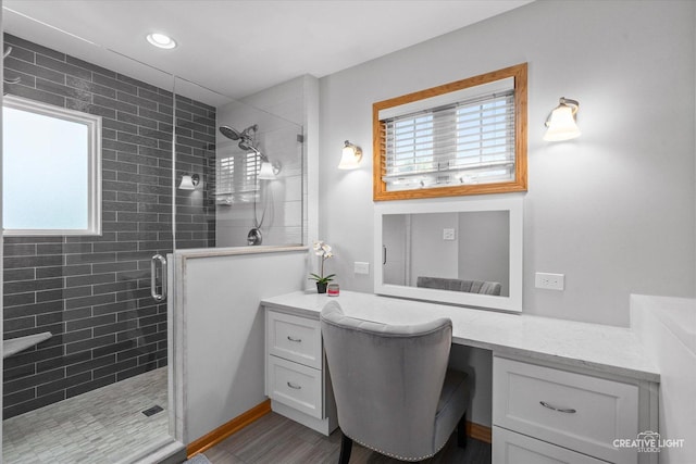 210 Fox Chase Dr N, Oswego, IL 60543 - bathroom with a shower stall, plenty of natural light, vanity, wood finished floors, and recessed lighting