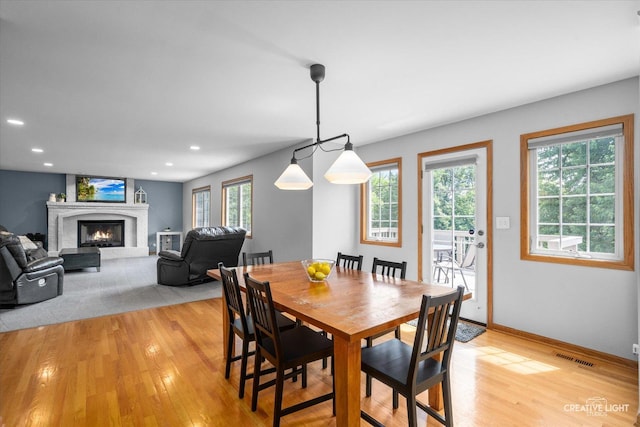 210 Fox Chase Dr N, Oswego, IL 60543 - dining area with light wood-style floors, a fireplace, and recessed lighting
