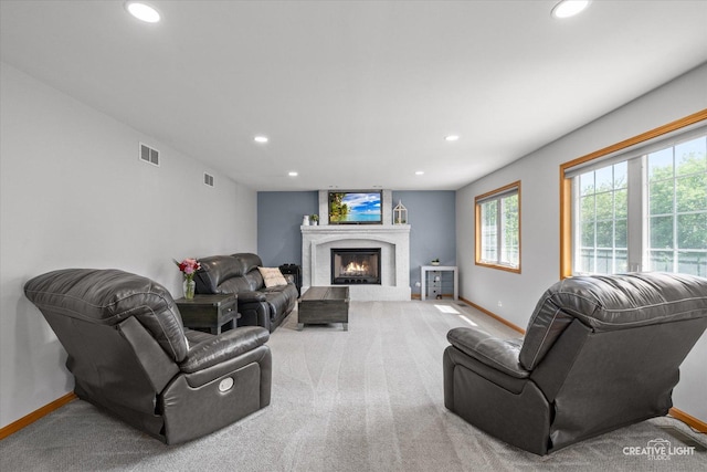 210 Fox Chase Dr N, Oswego, IL 60543 - carpeted living room with recessed lighting and a warm lit fireplace