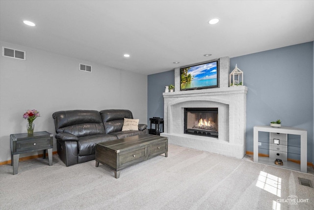 210 Fox Chase Dr N, Oswego, IL 60543 - carpeted living room featuring a fireplace and recessed lighting