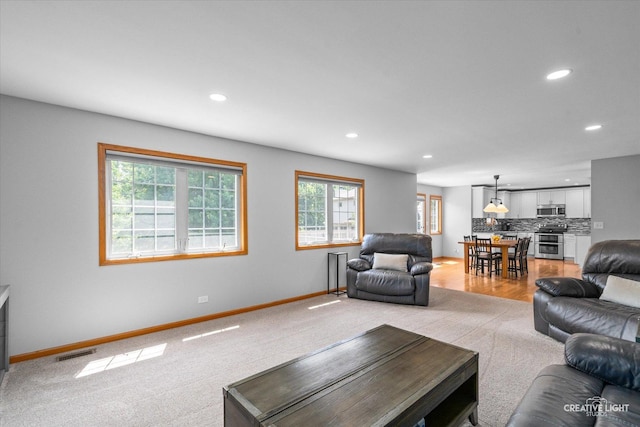 210 Fox Chase Dr N, Oswego, IL 60543 - living area with recessed lighting and light carpet