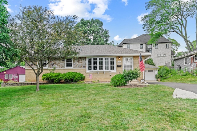 108 6th St, Downers Grove, IL 60515 - view of front facade featuring driveway, a front lawn, and brick siding